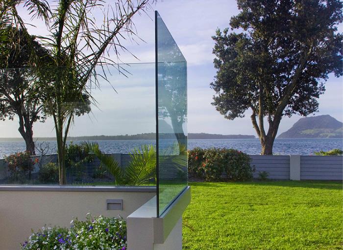 Frameless glass balustrade with side mounted channel system.
