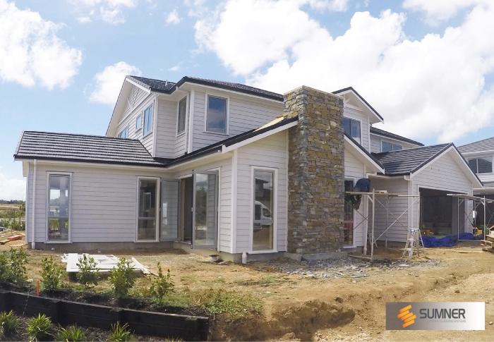 Our SUMNER Lakes was installed on this new Karaka Lakes home.
The owners chose this stonework to match other grey/brown used in the subdivision.