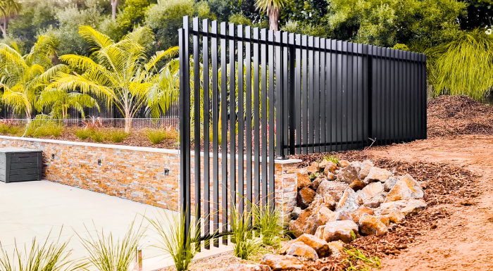 Vertical Batten Pool Fence, able to be 1.8m high to meet council requirements for height changes and drop offs.