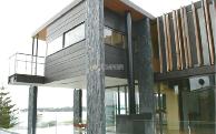 This St Heliers home designed by Pete Bossley Architects relies heavily on our feature SUMNER Roxbrough stonework.