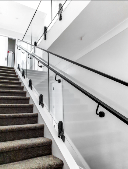 Internal Architectural stairwell with Nano rail and hand rail in black finish.