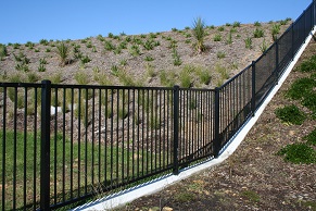 Long Bay sub development required a panel that would contour with the rolling hills while offering balustrade compliance.  Installed along path ways, retaining walls, parks and stairs.