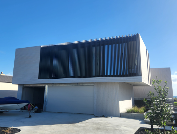 Vertical Batten privacy screen with safety from falling in front of Ranch sliders.