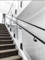 Internal Architectural stairwell with Nano rail and hand rail in black finish.