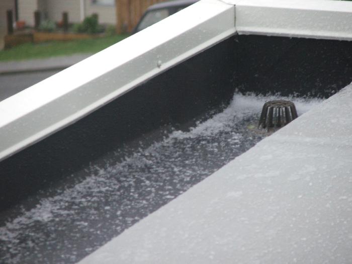 Combined use of 1mm Black Butynol in gutters and 1.5mm Dove Grey on roof areas