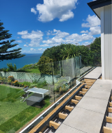 Floating Timber framed deck with Clearline balustrade connected. Tile overlay
