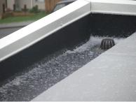Combined use of 1mm Black Butynol in gutters and 1.5mm Dove Grey on roof areas