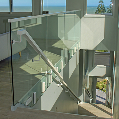 Edgetec JH Clamp frameless glass balustrade on an stairway